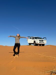 4x4 desert tour in Morocco – driving through sand dunes.